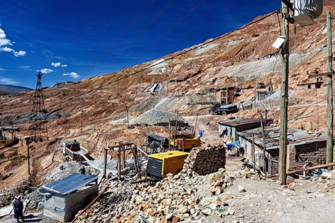 Huts and cable poles on the mountainside with an intense blue sky in the background, The silver