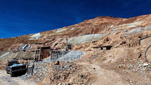 Stony landscape with an old lorry on an unpaved road, The silver mines of Potosi Bolivia
