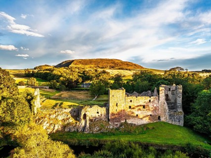 Ruins of Hailes Castle over River Tyne from a drone, East Linton, East Lothian, Scotland, UK