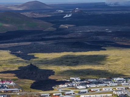 Lava, lava field, village, houses, summer, cloudy, sunny, aerial view, volcanic eruption, July