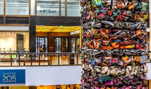 Interior design, artwork made from compressed scrap cars, partially vacant Shopping Quartier 205 in