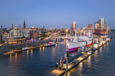 Aerial view of the Landungsbrücken Hamburg (Jan-Fedder-Promenade) at blue hour with Elbe, Cap San
