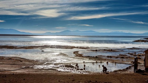 Landscape with hot springs, people and sweeping views of the lake and mountains, The thermal