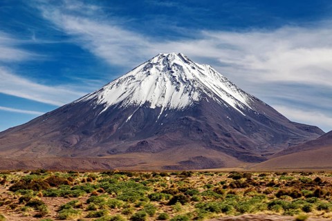 A single snow-covered peak rises majestically into the sky, The landscape with the volcanoes on the