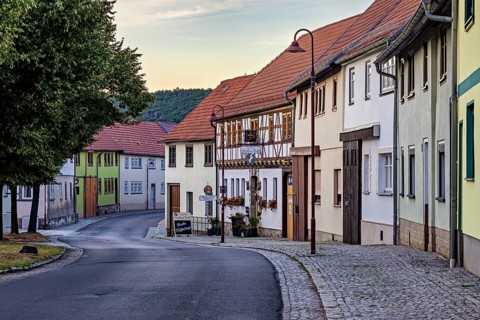 Idyllic old town with half-timbered houses and cobbled street in a quiet evening mood, the village