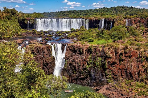 Wide waterfall with rocks and dense forest, peaceful and spectacular scenery, The Iguazu Falls