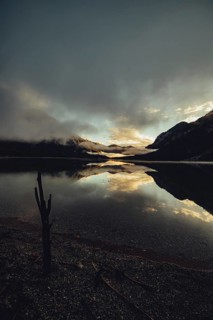 Sunrise with reflections in the Plansee in Tyrol in the Alps in Austria