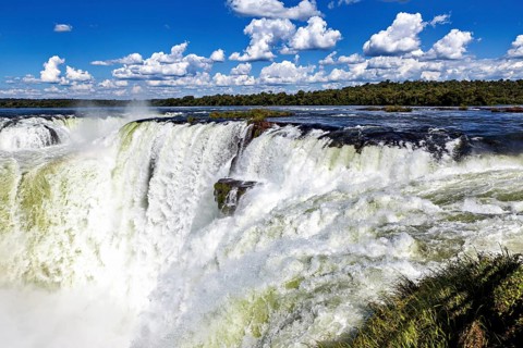 Close-up of a rushing waterfall showing a strong water current, The Iguazu Falls between Argentina