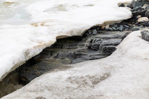 Melting glacier, stones, water, Cooper Camp, Spitsbergen, Svalbard