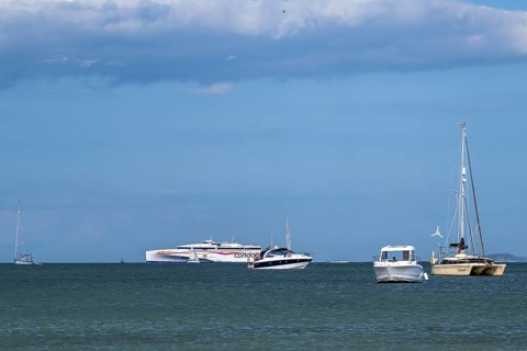 Boats on sea over Knoll Beach Studland, Poole, Dorset, England, United Kingdom