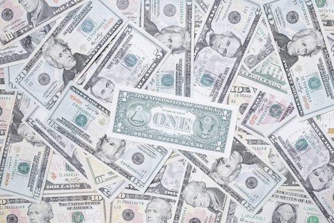 Various US dollar notes in a pile, banknotes