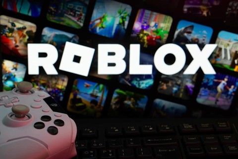 Dhaka, Bangladesh- 26 July 2025: A close-up of a white gamepad with The Roblox seen on screen in