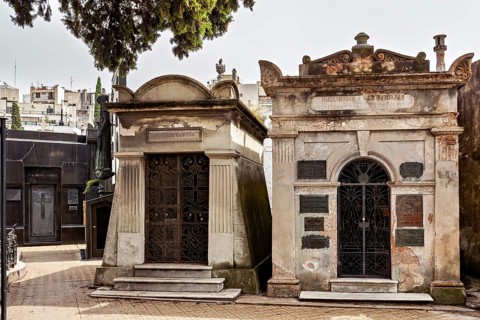 Two adjoining tombs in a cemetery with decorative elements, La Recoleta Cemetery in Buenos Aires