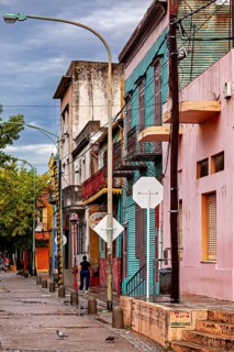 Street with old, colour-faded buildings and a quiet environment, The colourful city and tango