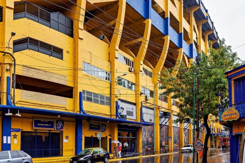 Yellow and blue stadium on a rainy street with trees, The football stadium of La Bocca of Bocca