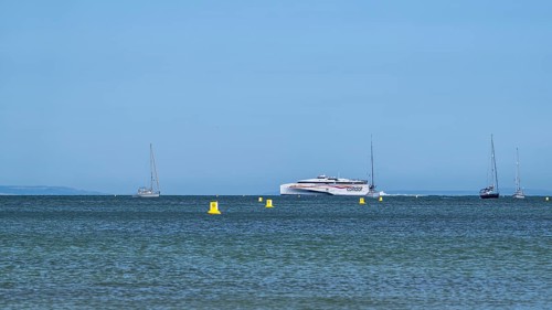 Boats on sea over Knoll Beach Studland, Poole, Dorset, England, United Kingdom