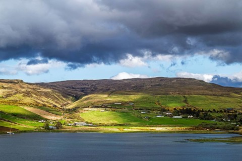 Farms over Loch Harport, Drynoch, Isle of Skye, Scotland, UK
