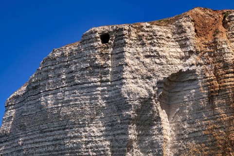 View of the Eye of the Panda, L'oeil du Panda, rock window, cave, in the rock arch Falaise