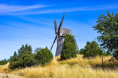 Historic windmill in an epic summer landscape near the burial ground of Stenhusbacken and the