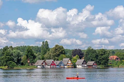 Boathouses, holiday homes on Lake Mirow, canoe, Mirow, Mecklenburg Lake District,