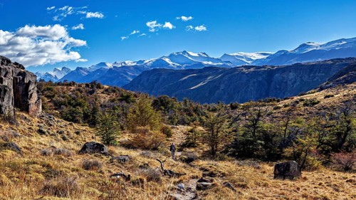 Picturesque mountain landscape with a hiker on a path under a clear sky, The landscape of Patagonia