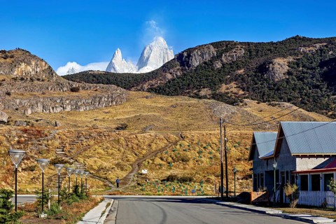 A peaceful little village with a view of rugged mountain peaks and clear skies, the Patagonian
