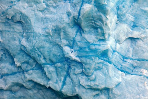 Close-up of the structured ice surface with blue cracks, The blue ice of the Perito Moreno Glacier