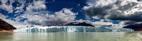 Idyllic panoramic view of a glacier and mountain range under a dynamic sky, The glacier of Perito