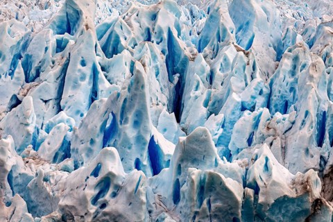 Detailed image of blue and white glacier structures with fascinating ice formations, The ice of the