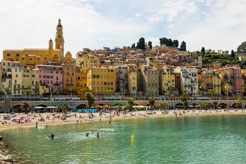 Town with colourful houses by the sea, Plage des Sablettes, Menton, Alpes Maritimes, Provence Alpes