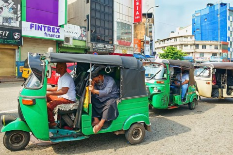 Motorized tuk tuk in a shopping street, Colombo, Sri Lanka
