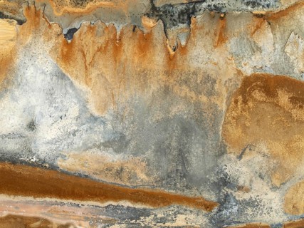 Abstract saline patterns at the edge of the Walvis Bay salt works. Aerial view. Drone shot. Namibia