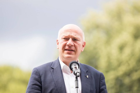 Kai Wegner (Governing Mayor of Berlin) gives a speech in front of the raising of the rainbow flag