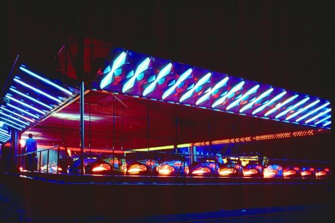 Illuminated bumper cars at night, New Jersey, USA
