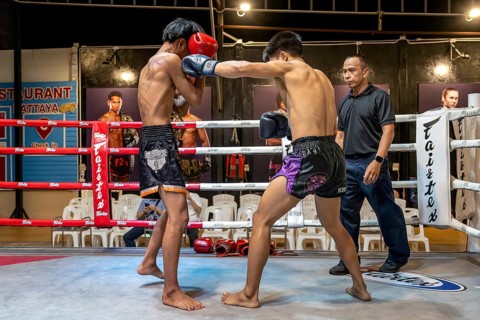 Thai boxing Muai Thai boxer in action, Pattaya, Thailand