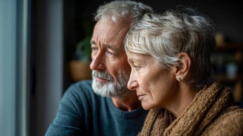 Senior couple grieving. Senior couple with health concerns or trouble in their lives or family, AI