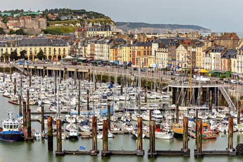 Coastal view of a harbour with numerous boats, lined with historic buildings, The harbour of Dieppe