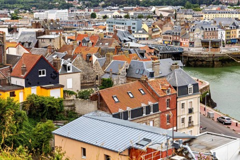 Colourful houses and roofs of the old town on the riverbank in a picturesque coastal town, The port