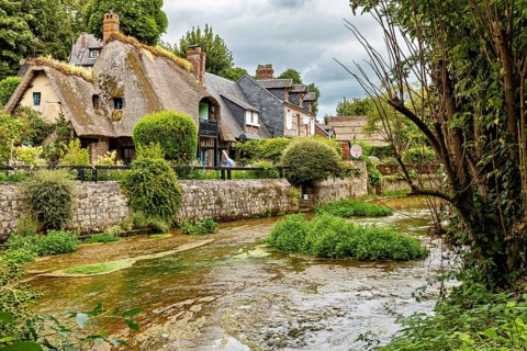 Charming cottage by a river with lush vegetation and historic flair, the historic mill village of