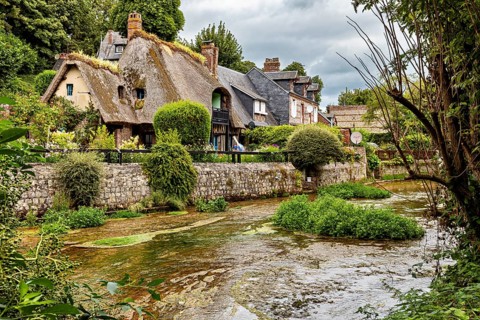 Historic cottages near the river nestled in a magnificent green setting, the historic mill village