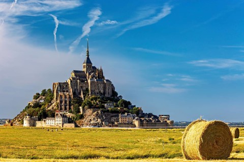 Imposing view of Mont Saint-Michel with a bale of straw in the foreground, Mont Saint Michel in