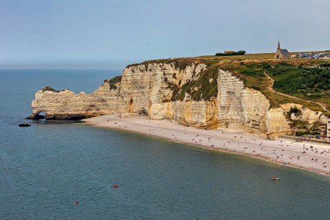 Imposing cliffs with a church at the top and a quiet beach by the sea, The cliffs and alabaster