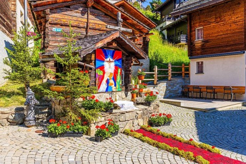 Flower-decorated altar for the Corpus Christi procession, historic village centre, Grimentz, Val