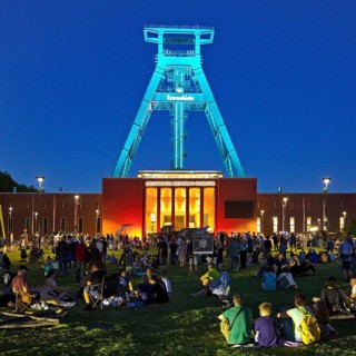 People in front of the German Mining Museum for the Extra Shift at night, Bochum, Ruhr Area, North