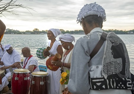 Detroit, Michigan - African-Americans gather on the banks of the Detroit River to commemorate