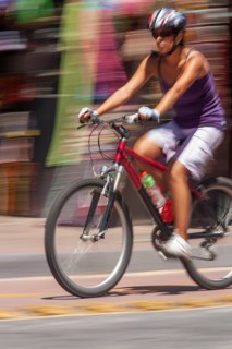 Woman riding a bicycle, Photo with motion blur, City of Quito, Pichincha province, Ecuador, South