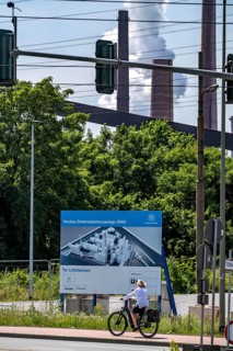Construction site sign for thyssenkrupp Steel's first direct reduction plant, the climate-neutral