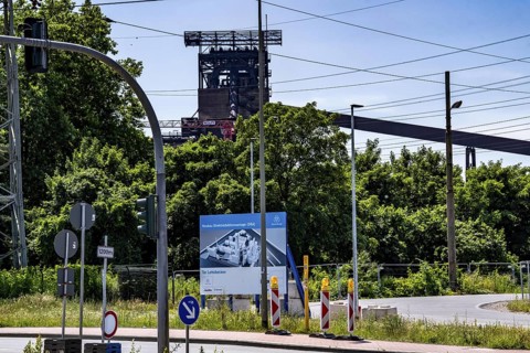 Construction site sign for thyssenkrupp Steel's first direct reduction plant, the climate-neutral