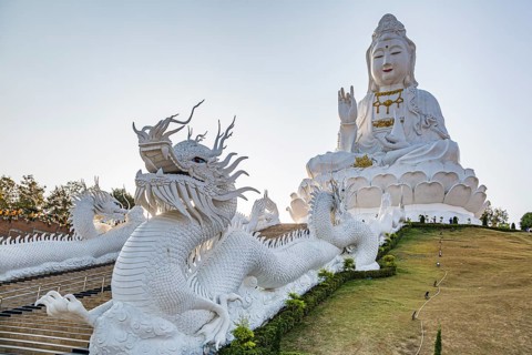 Chinese dragons line the steps up to the Guan Yin (Goddess of Mercy) statue at Wat Huay Pla Kang