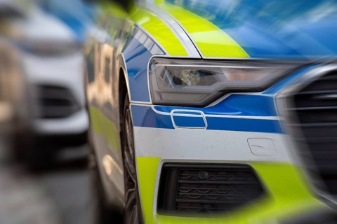Symbolic image police operation: close-up of police emergency vehicles